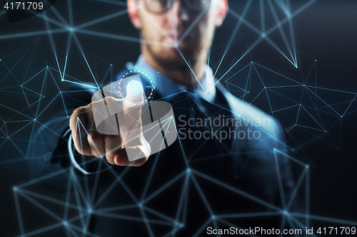 Image of businessman with virtual network hologram
