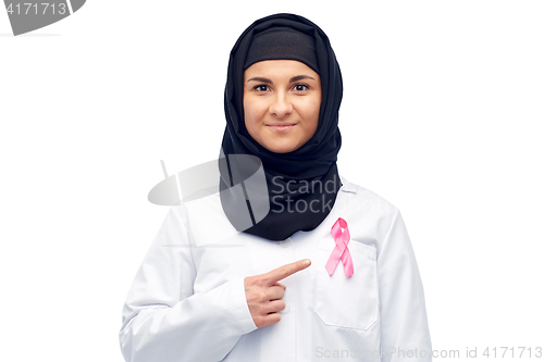 Image of muslim doctor with breast cancer awareness ribbon