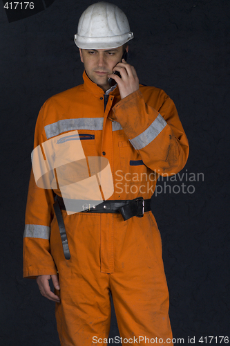 Image of Worker talking on a cell phone