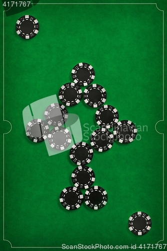 Image of The poker chips on green background