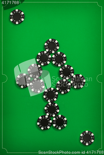 Image of The poker chips on green background