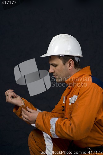 Image of worker getting ready