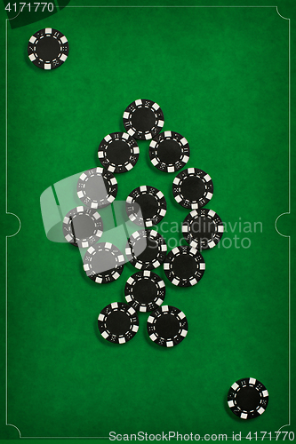 Image of The poker chips on green background