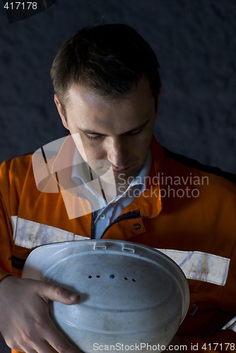 Image of worker preparing himself