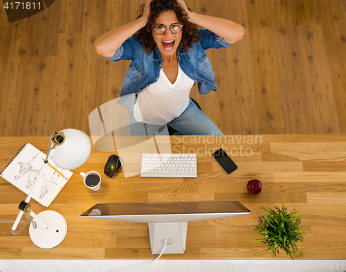 Image of Stressed woman working