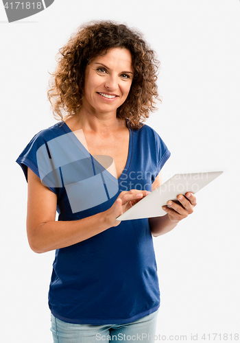 Image of Happy woman working with a tablet