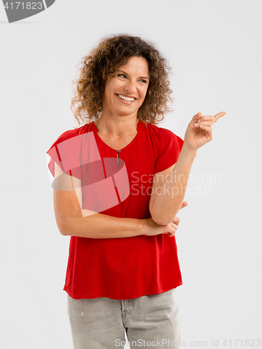 Image of Happy woman pointing