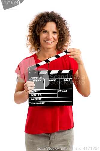 Image of Happy mature woman holding a clapboard