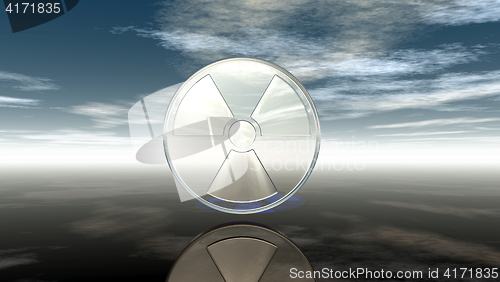 Image of nuclear symbol under cloudy sky - 3d illustration