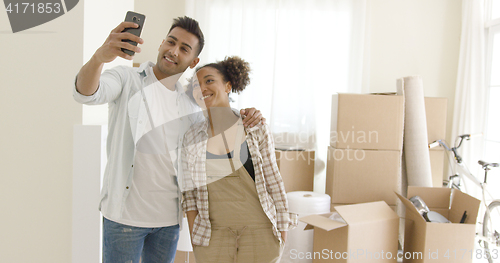 Image of Happy young couple posing for a selfie