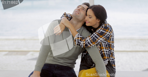 Image of Loving young woman hugging her boyfriend