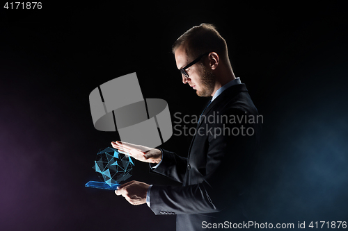 Image of businessman with tablet pc and virtual projection