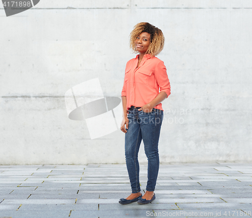 Image of happy african american young woman over white