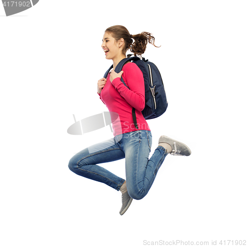 Image of happy woman or student with backpack jumping
