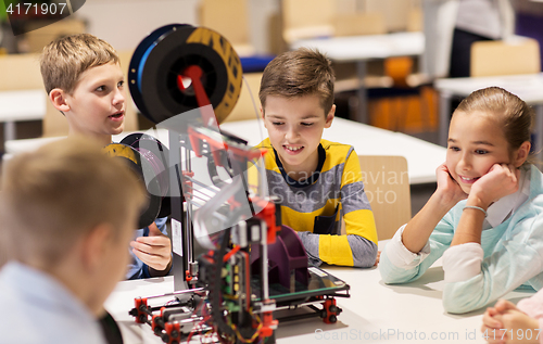 Image of happy children with 3d printer at robotics school