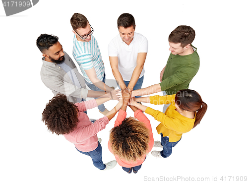 Image of international group of happy people holding hands