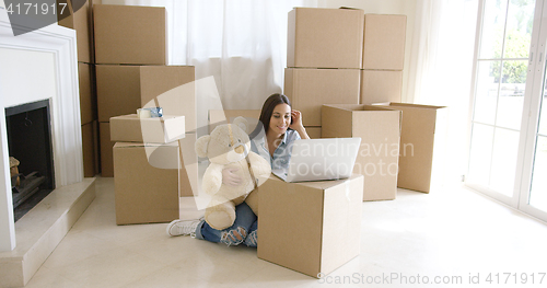 Image of Smiling woman catching up on her social media