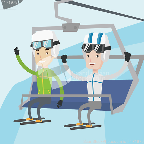 Image of Two happy skiers using cableway at ski resort.