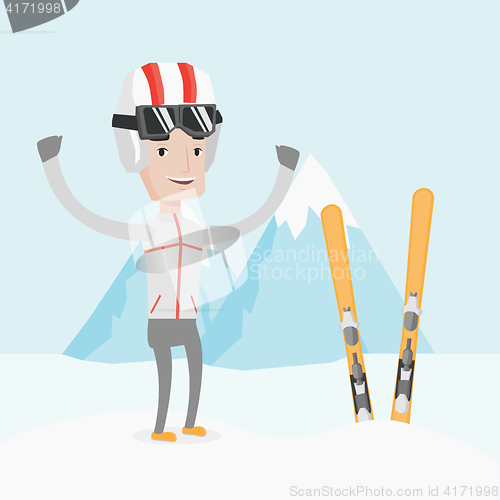 Image of Cheerful skier standing with raised hands.