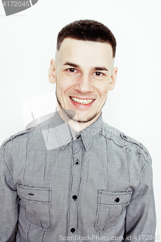 Image of young handsome well-groomed guy posing emotional on white background, lifestyle people concept 