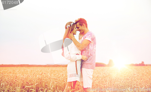 Image of happy smiling young hippie couple outdoors