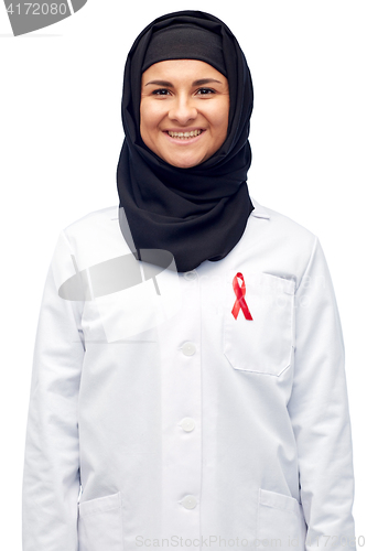 Image of muslim doctor in hijab with red awareness ribbon