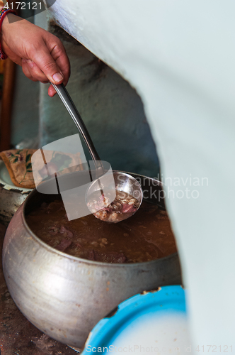 Image of cooking meals in a Russian stove