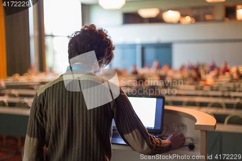 Image of Public speaker giving talk at scientific conference.