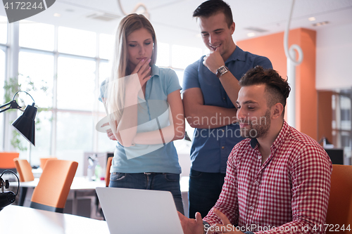 Image of Group of young people employee workers with computer