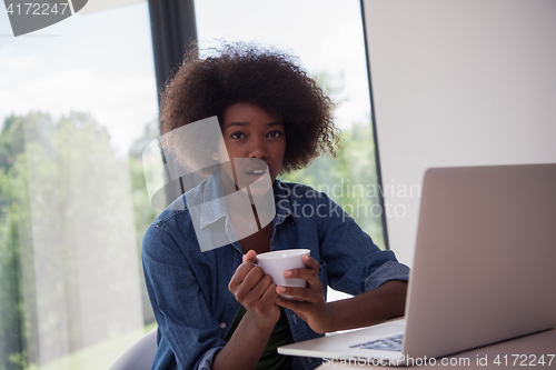 Image of African American woman in the living room