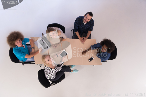 Image of Multiethnic startup business team on meeting  top view