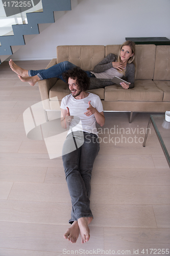 Image of young couple relaxes in the living room