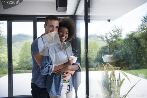 Image of romantic happy young couple relax at modern home indoors