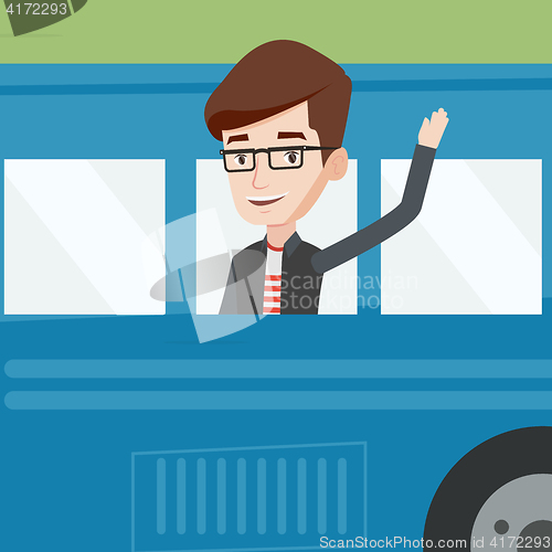 Image of Man waving hand from bus window.