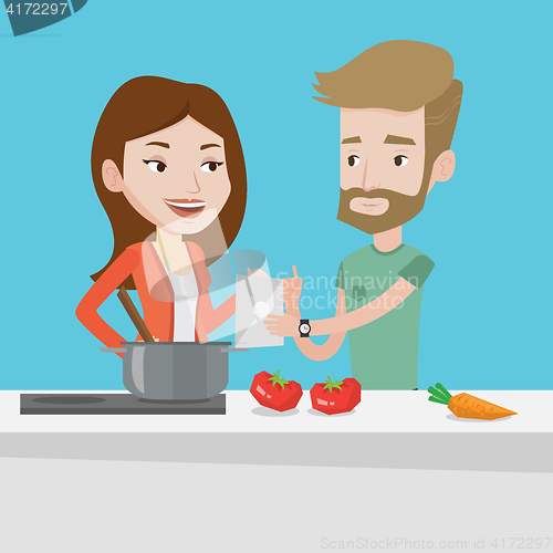 Image of Couple cooking healthy vegetable meal.