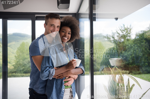 Image of romantic happy young couple relax at modern home indoors