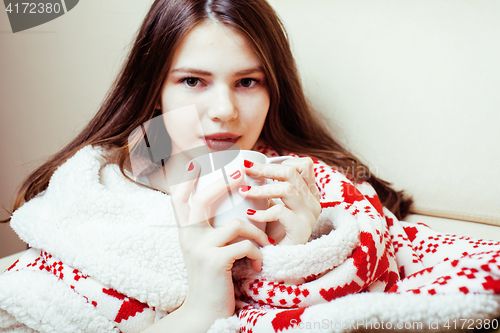 Image of young pretty brunette girl in Christmas ornament blanket getting warm on cold winter, freshness beauty concept, lifestyle people