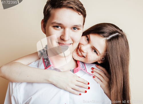 Image of young pretty teenage couple, hipster guy with his girlfriend hap