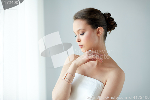 Image of beautiful asian woman with ring and bracelet