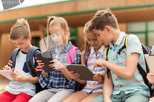 Image of group of happy elementary school students talking