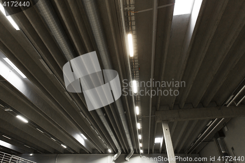 Image of warehouse ceiling with lamps