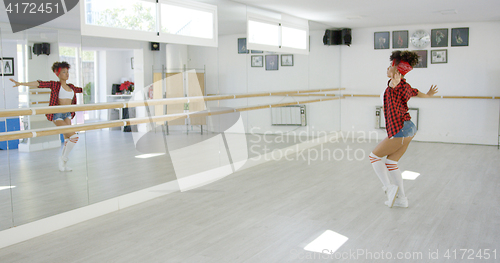 Image of Dancing student performs in bright studio
