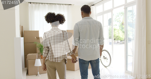 Image of Loving young couple saying goodbye to their home