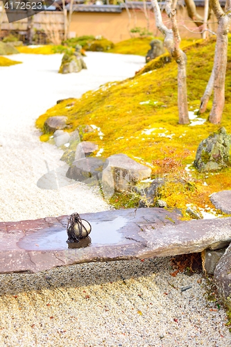 Image of Tome ishi, a path blocking stone, on a small stone bridge