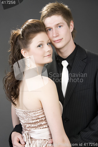 Image of Portrait of a young beautiful couple embracing.