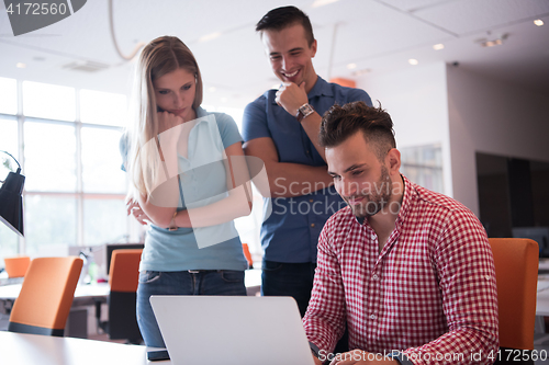 Image of Group of young people employee workers with computer