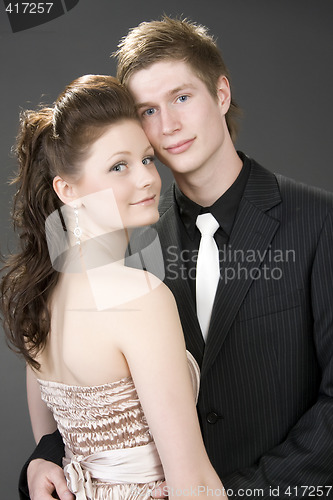 Image of Portrait of a young beautiful couple embracing.