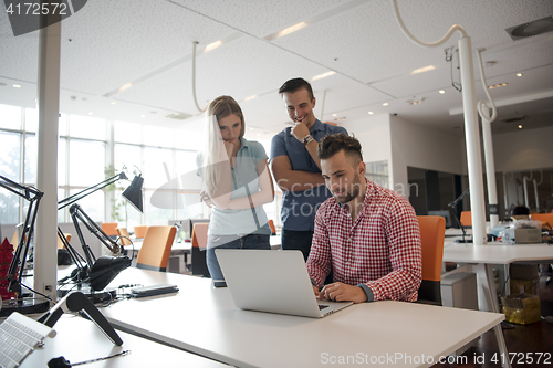 Image of Group of young people employee workers with computer