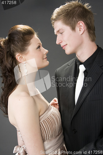 Image of Portrait of a young beautiful couple embracing.