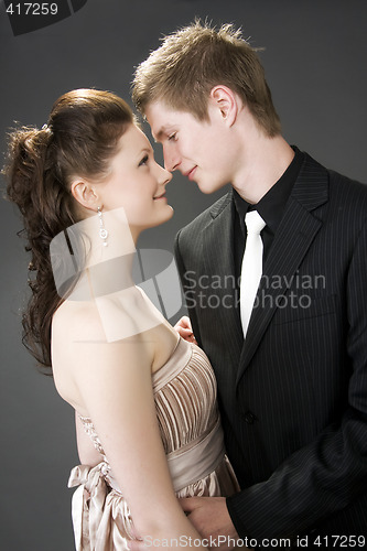 Image of Portrait of a young beautiful couple embracing.